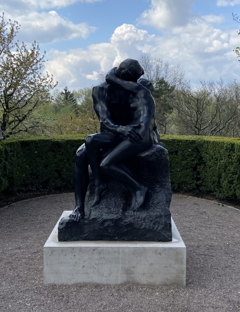 The Kiss by Auguste Rodin — sculpture of two figures embracing