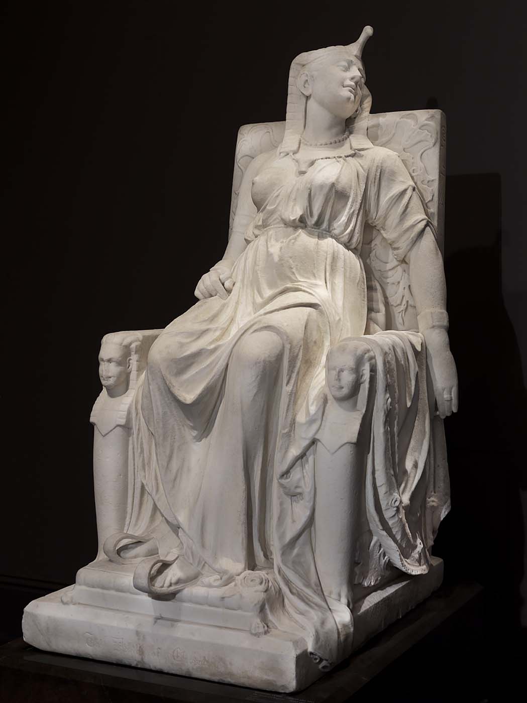 Edmonia Lewis's marble sculpture The Death of Cleopatra, 1876, showing the queen slumped on her throne